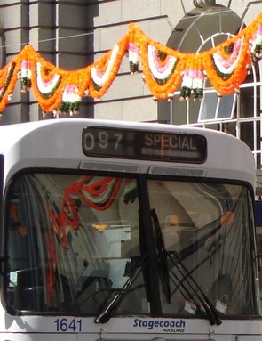 Janet F S Cotton;Bus Reflection;Britomarts bus reflects hanging decorations in window